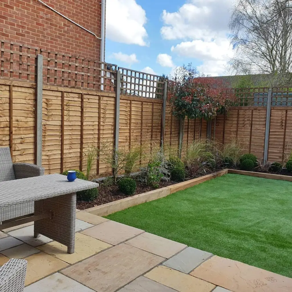 Fencing, raised beds and artificial grass for a low-maintenance garden