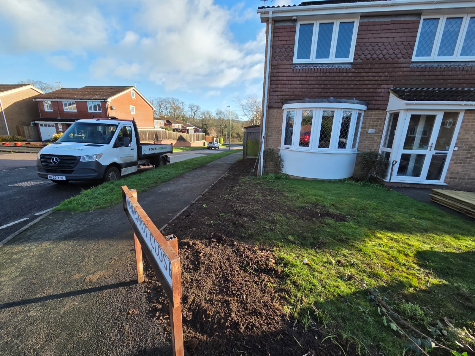 Front garden in Maidstone with ground cleared and prepared beside the existing lawn